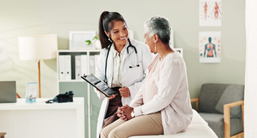 An image of a female doctor speaking with a patient.