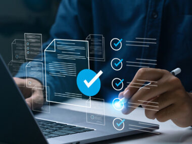 A person uses a laptop, with an online checklist superimposed between the person and the display.