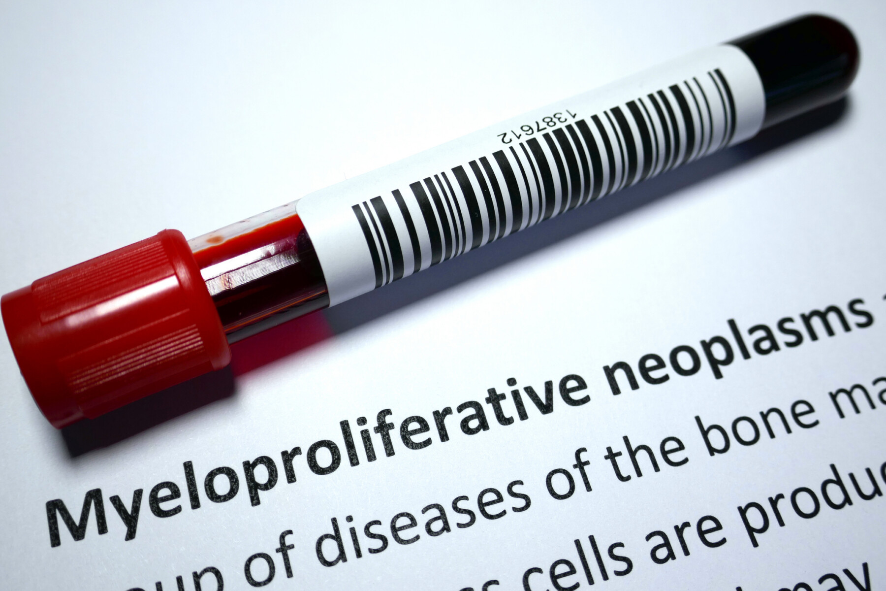 An image of a blood sample tube resting on a page labeled “Myeloproliferative neoplasms.”